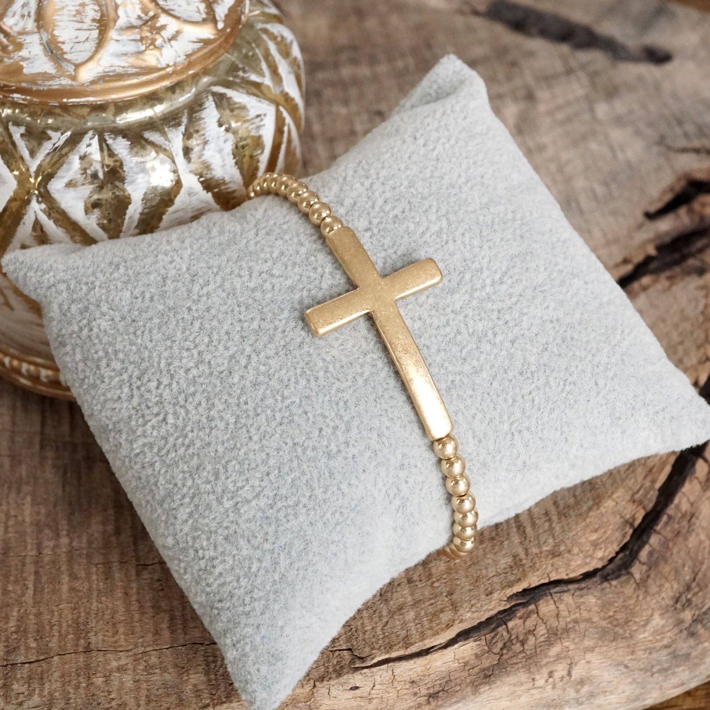 Cross Stretchy Bracelet in Worn Gold tone