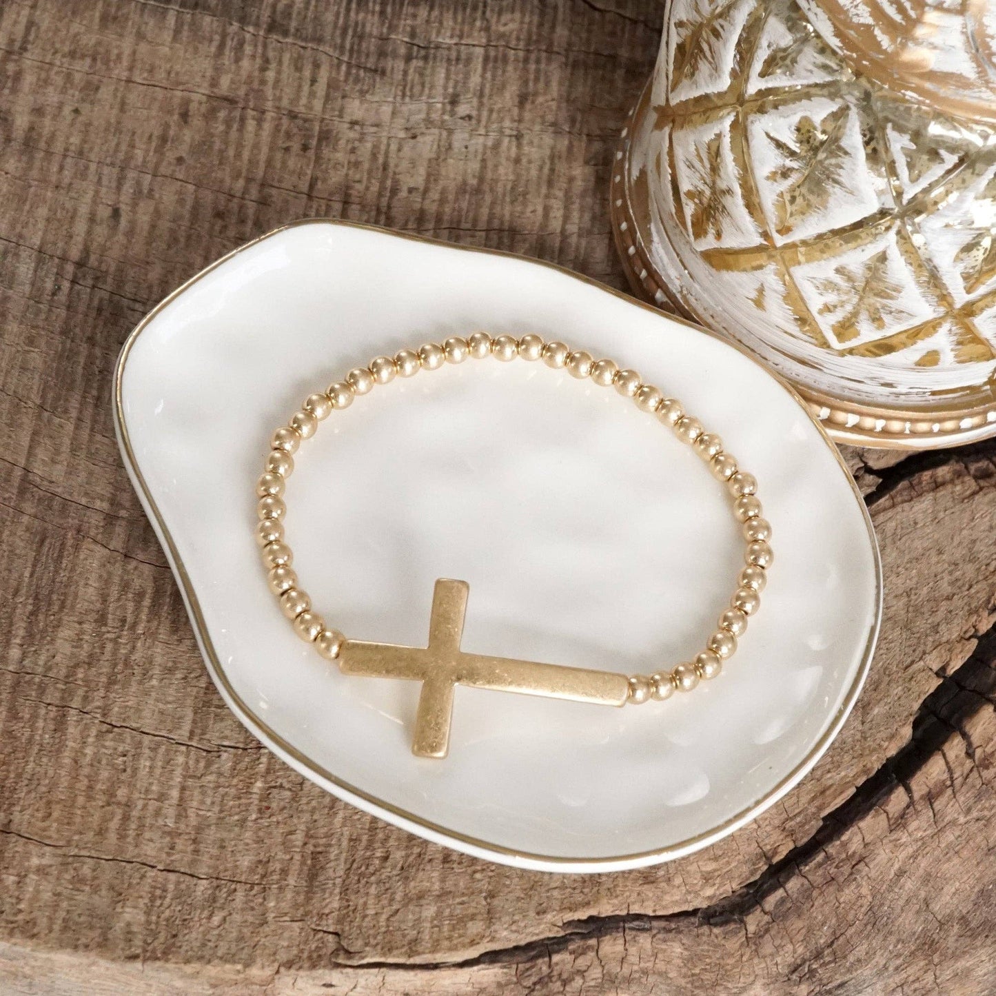 Cross Stretchy Bracelet in Worn Gold tone