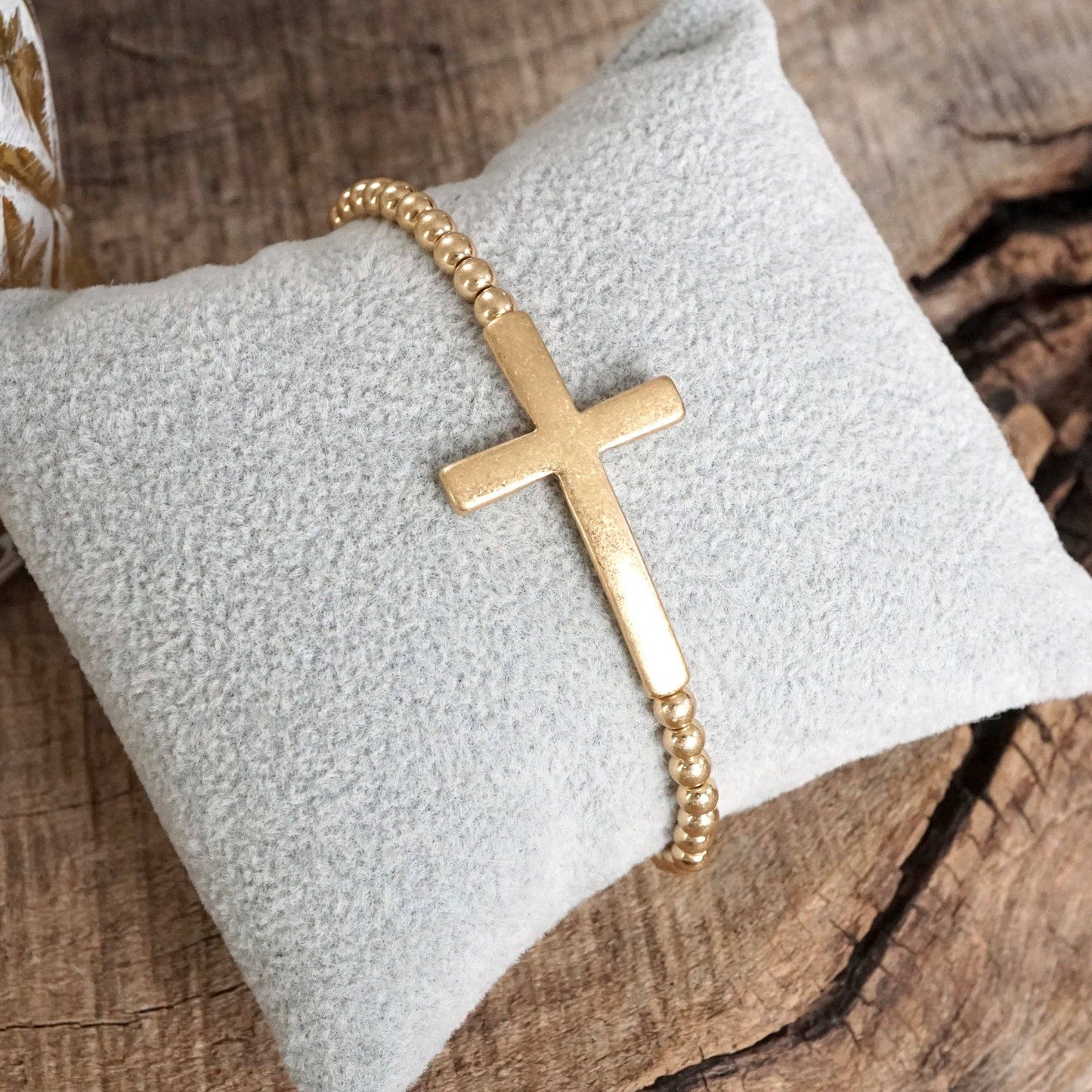 Cross Stretchy Bracelet in Worn Gold tone