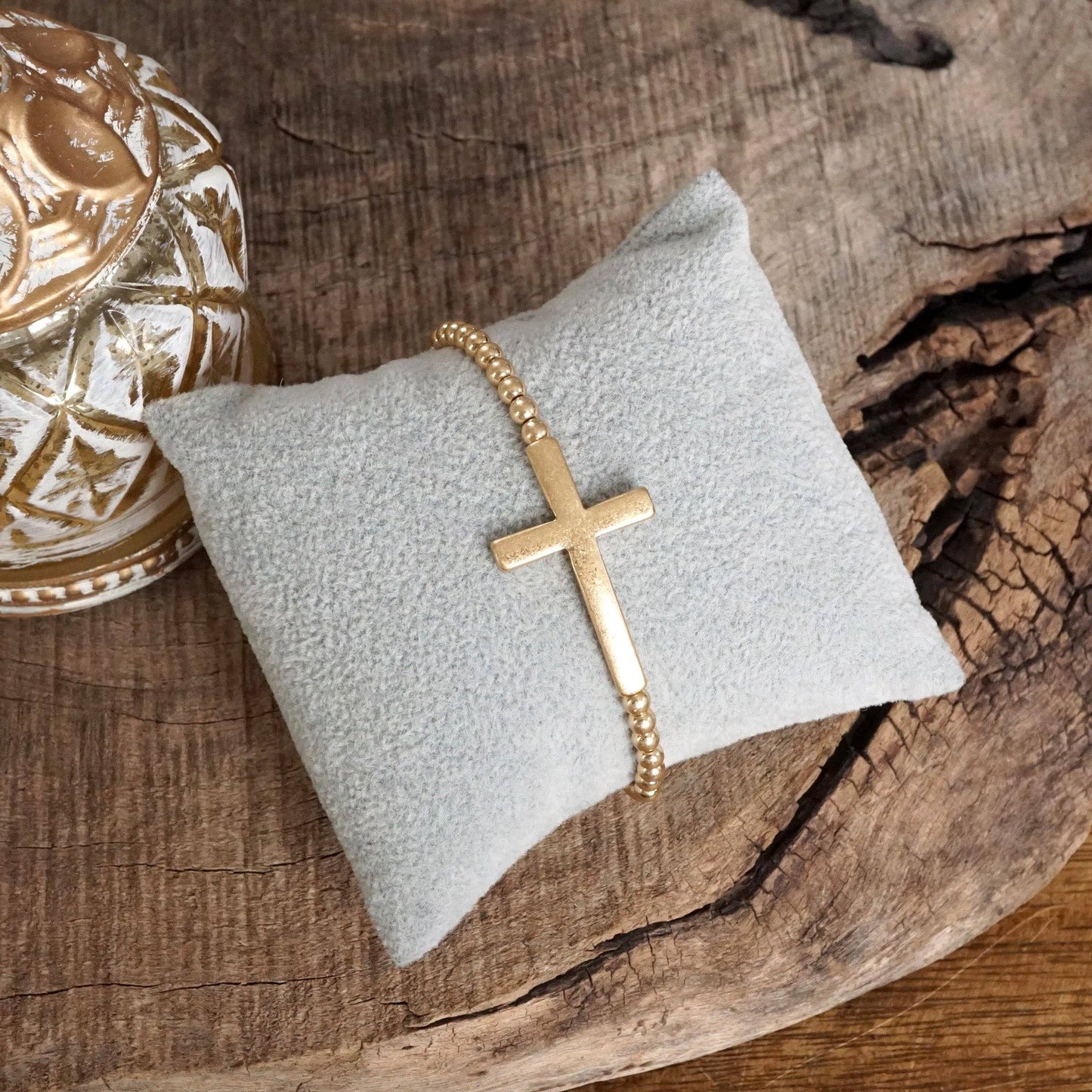 Cross Stretchy Bracelet in Worn Gold tone