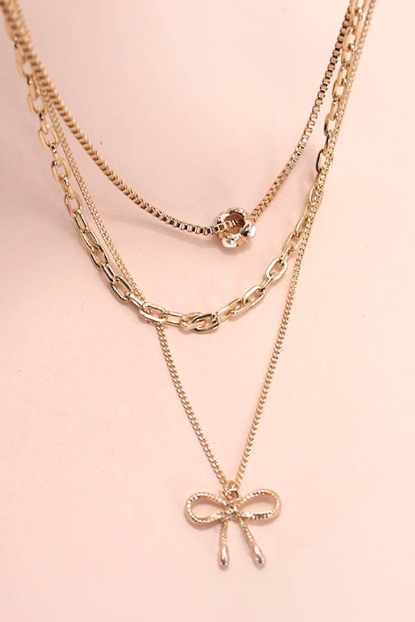 MULTI LAYER PEARL BOW CAHRMNECKLACE