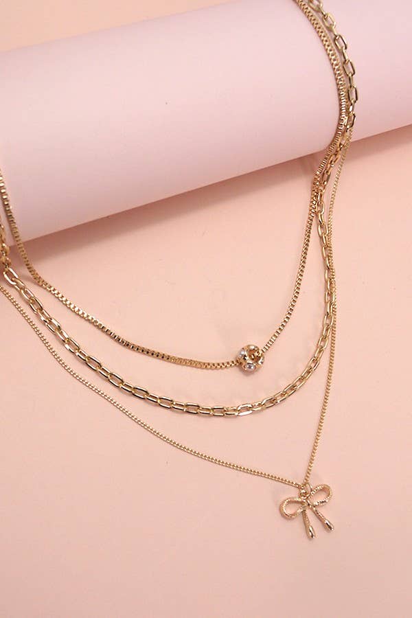 MULTI LAYER PEARL BOW CAHRMNECKLACE